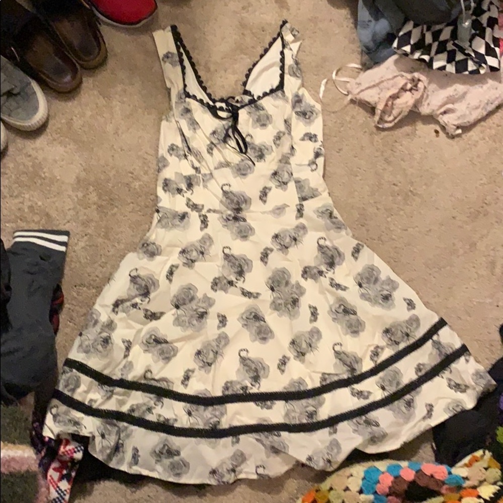 White dress with gray flowers and bugs